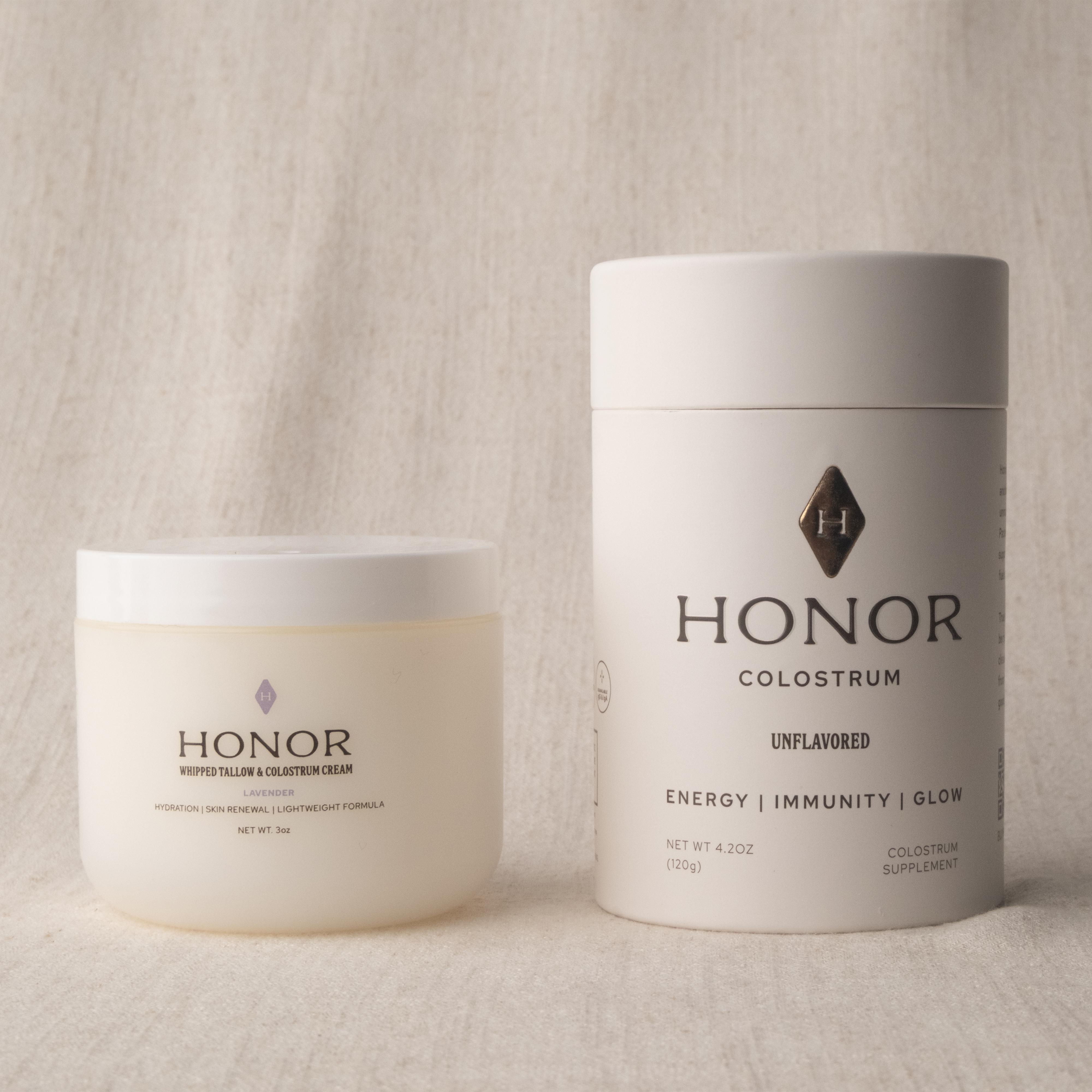 Honor Whipped Tallow & Colostrum Cream beside the Honor Colostrum tube